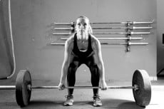 young woman on a weightlifting session - crossfit workout