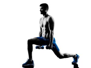 one caucasian man exercising lunges  fitness weights exercises in studio silhouette isolated on white background