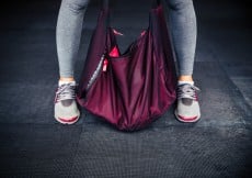 Female legs and sports bag