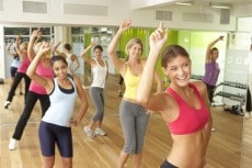 Women Taking Part In Zumba Class In Gym