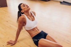 Tired woman resting after workout