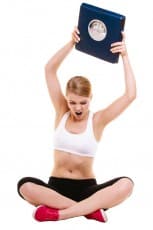 Angry woman weighing scale. Slimming weight loss.