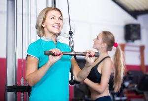 positive females of different age strength training in gym for women