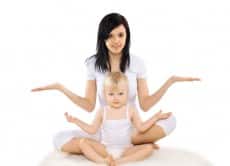 Mom and baby doing exercise, gymnastics, yoga, fitness and healt