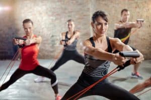group exercising with a resistance band