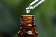 Pipette and bottle of essential oil