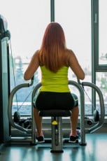 young woman doing back exercises