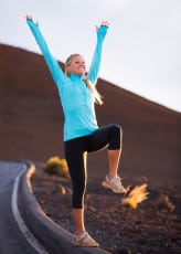 Young attractive athletic woman, wearing sporty cloths on trail,