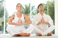 Young Couple Doing Yoga