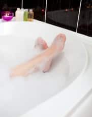 Woman's feet in a bubble bath
