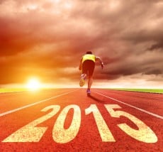 happy new year 2015. young man running with sunrise background