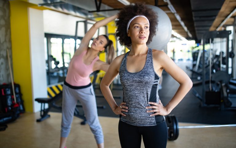 Beautiful,Women,Working,Out,In,Gym,Together