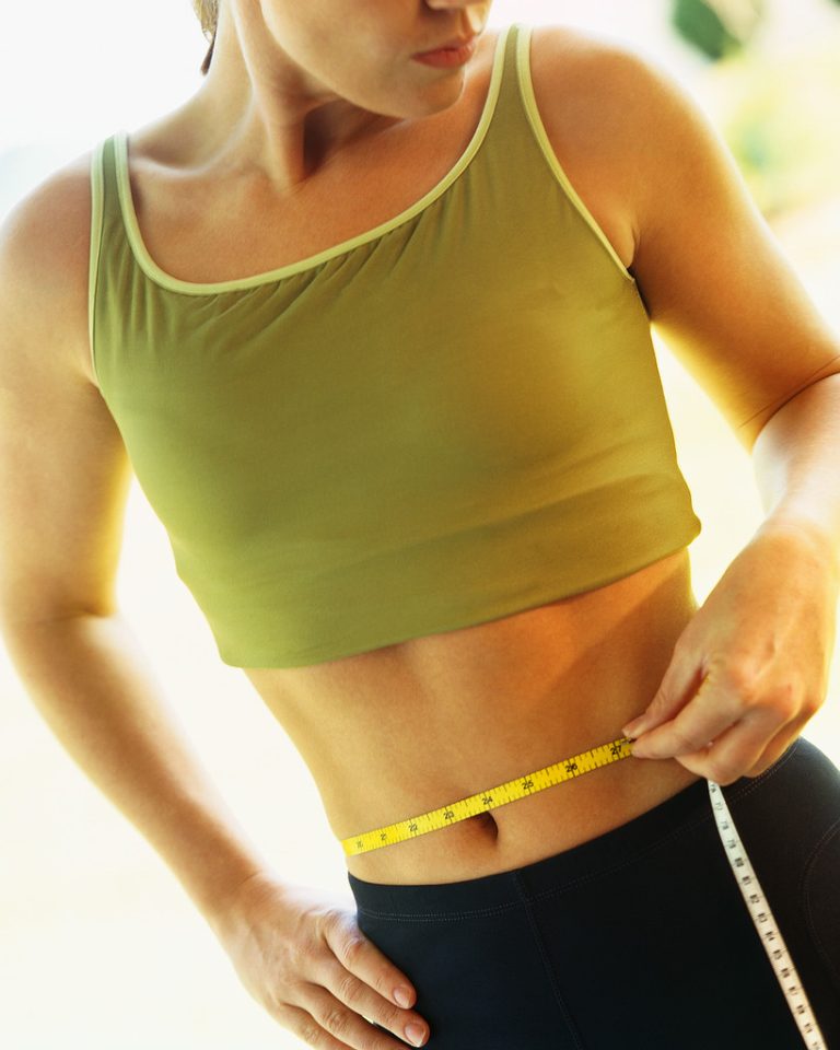 Woman Measuring Stomach