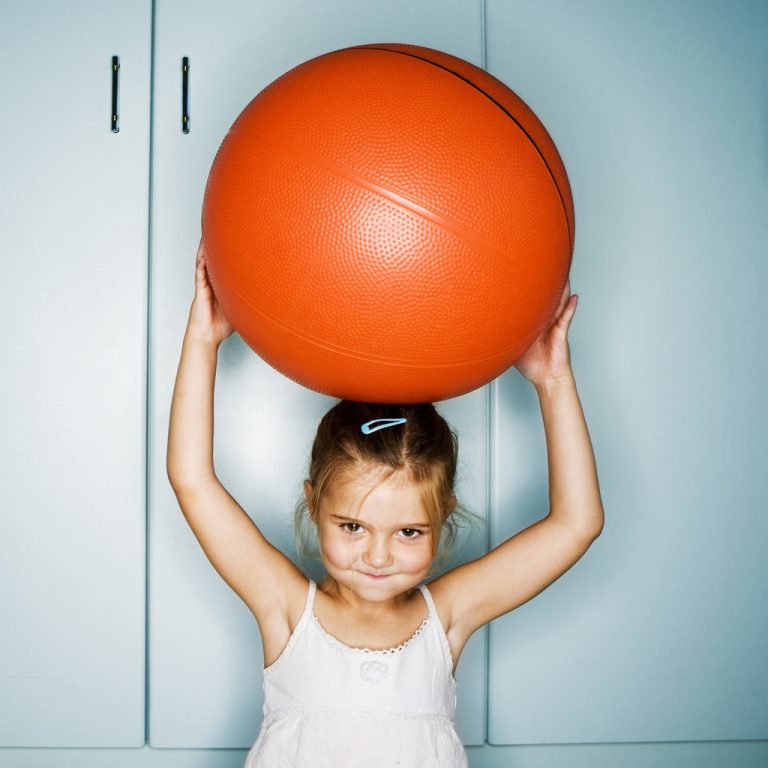Girl Playing With Exercise Ball