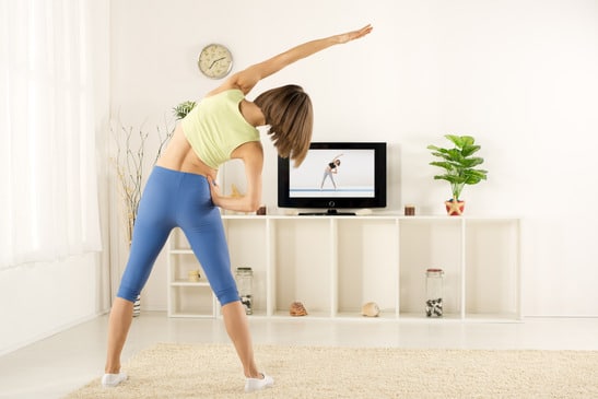 photodune-10986749-girl-exercise-watching-tv-xs