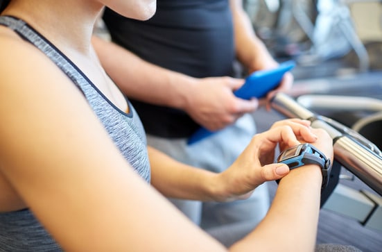 photodune-11374190-close-up-of-woman-setting-heartrate-watch-at-gym-xs