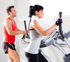 photodune-1445583-man-and-woman-with-elliptical-cross-trainer-at-gym-xs-1-230x203