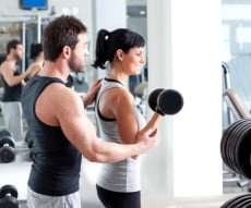 gym woman personal trainer with weight training