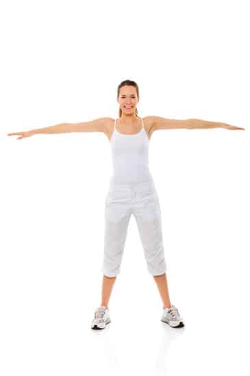 Young woman doing gymnastics on white background studio