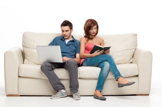 couple sitting comfortably in couch