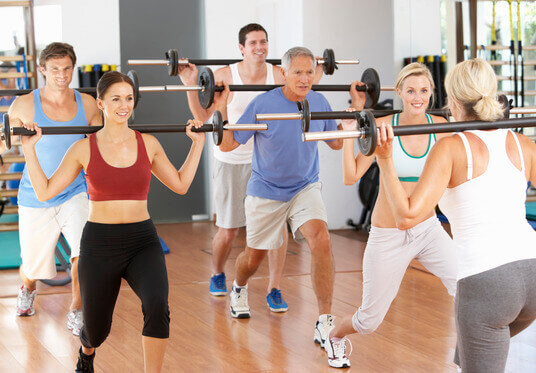 photodune-325092-group-of-people-lifting-weights-in-gym-xs-1