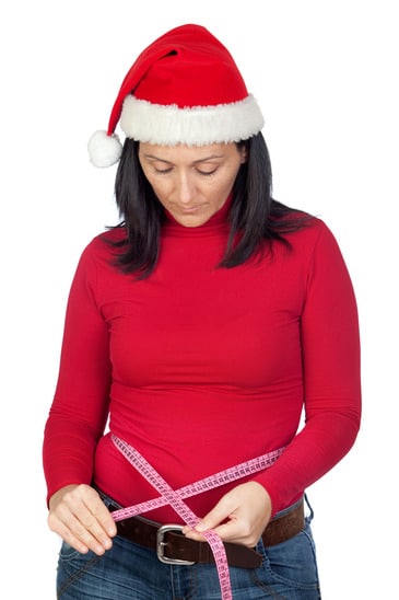 photodune-3251753-beautiful-girl-with-christmas-hat-measuring-her-waist-xs