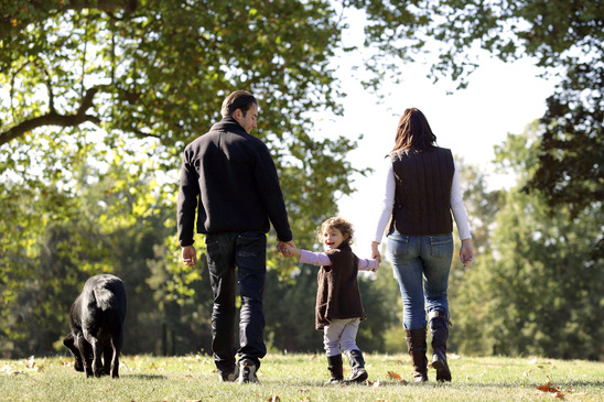 Family walking their dog