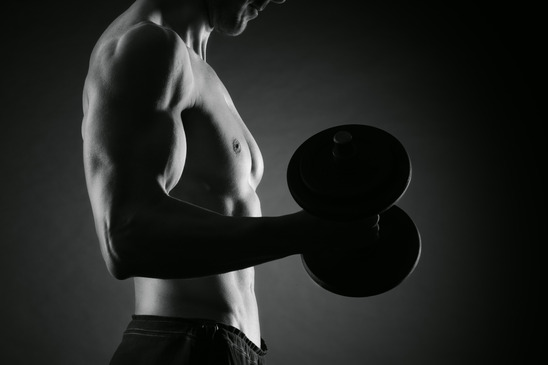 Exercising biceps with dumbbells