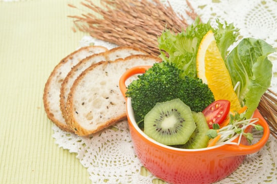 fusion food, fruit and vegetable salad in colorful cup with whol