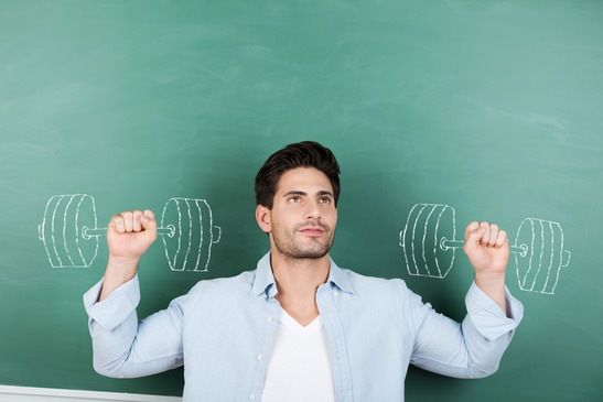 photodune-5193249-teacher-with-clenched-fists-against-dumbbells-drawn-on-chalkboar-xs