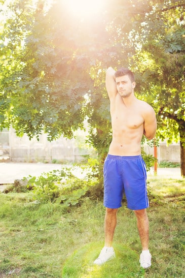 photodune-5402861-handsome-young-guy-stretching-his-triceps-after-workout-xs