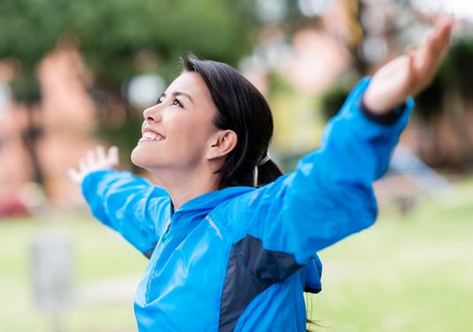 Happy woman exercising outdoors