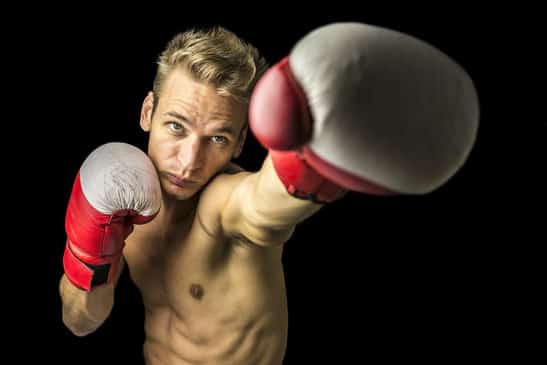 Young boxer performing a punch