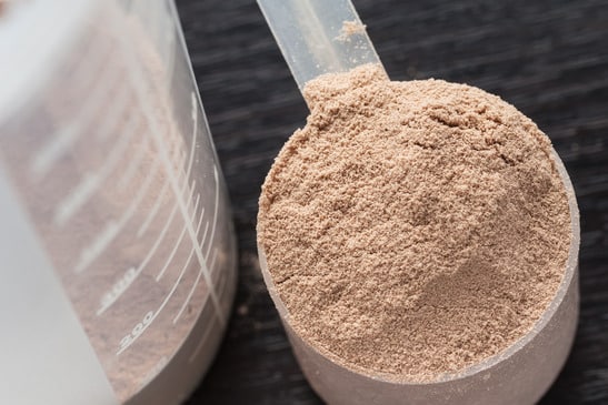 photodune-6571243-scoop-of-chocolate-whey-isolate-protein-in-front-of-protein-shaker-xs