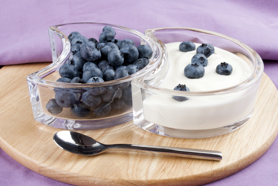 blueberries with fresh yogurt and a spoon