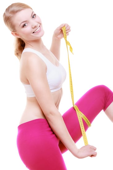 photodune-6934038-fitness-girl-sporty-woman-measuring-her-thigh-isolated-xs1