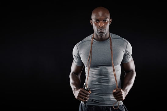 photodune-9747216-handsome-muscular-man-posing-with-jumping-rope-xs