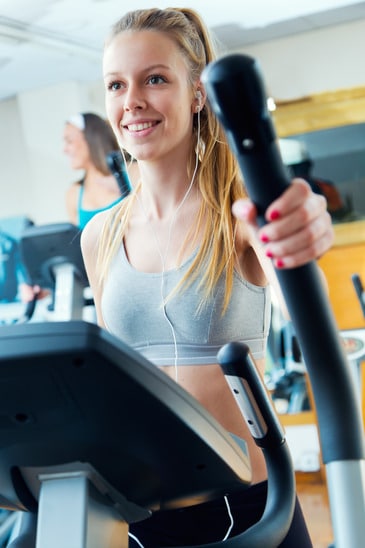 photodune-9927779-young-people-with-elliptic-machine-in-the-gym-xs