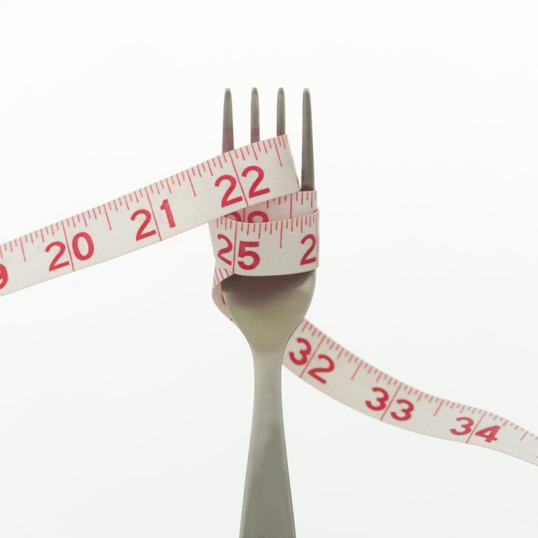 Measuring Tape Wrapped Around Fork